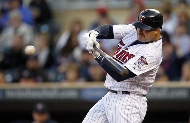 Minnesota Twins Ryan Doumit hits a two-run homerun off Los Angeles Angels starting pitcher Dan Haren